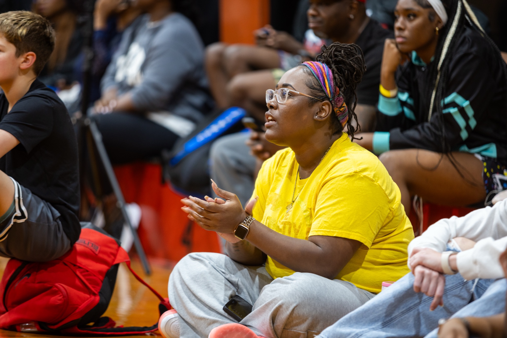 Fans watching courtside at the One For All 3-on-3 Basketball Tournament